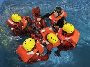 wla Sea Survival Training 5 people performing a rescue